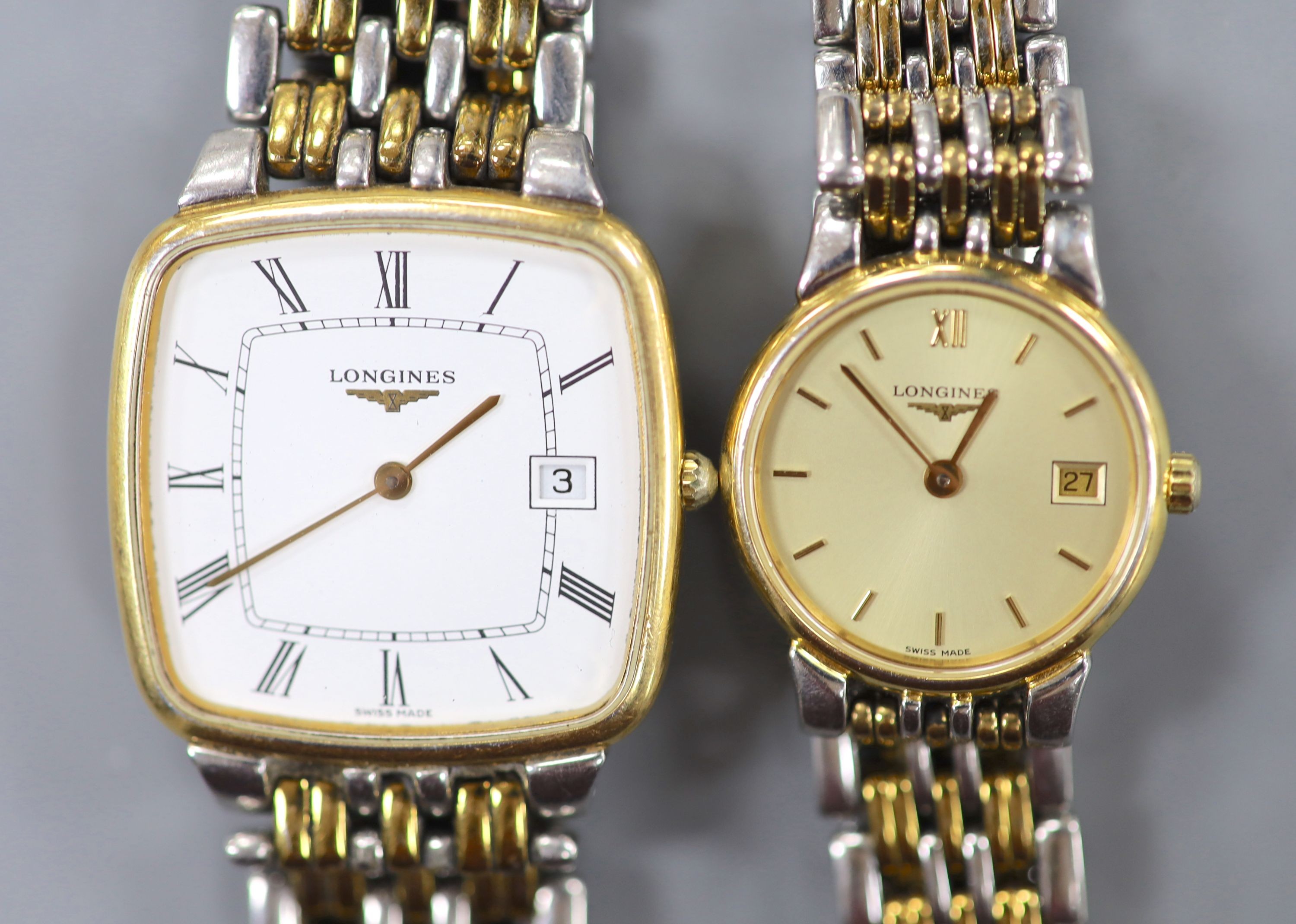 A gentleman's steel and gold plated Longines quartz wrist watch and a similar lady's watch.